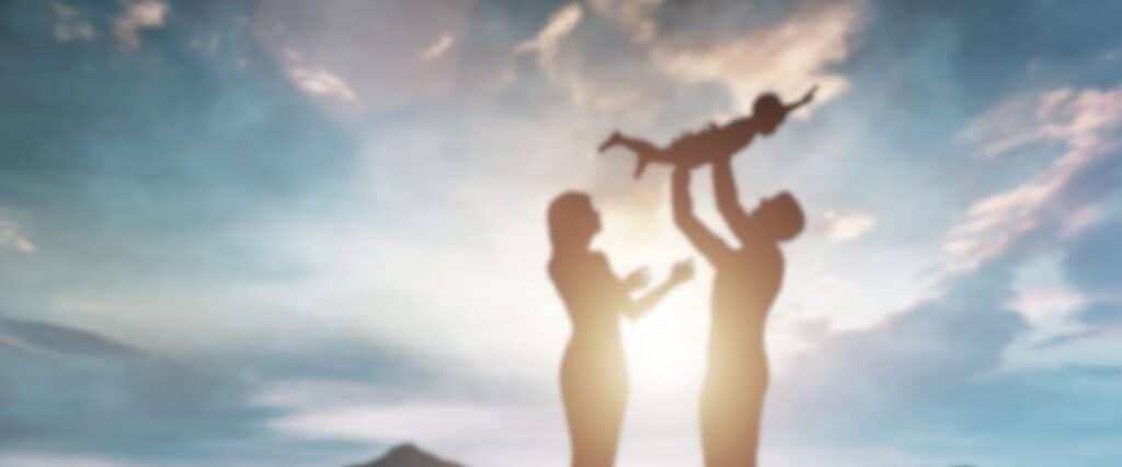 Orthodox Christian Family with Child in Evening Light